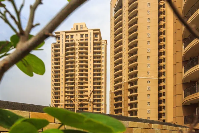 ATS Kocoon Gurgaon - tower elevation framed by tree thumbnail