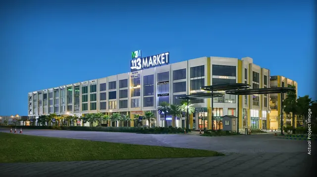 M3M 113 Market - Actual project image at dusk with 113 Market signage thumbnail